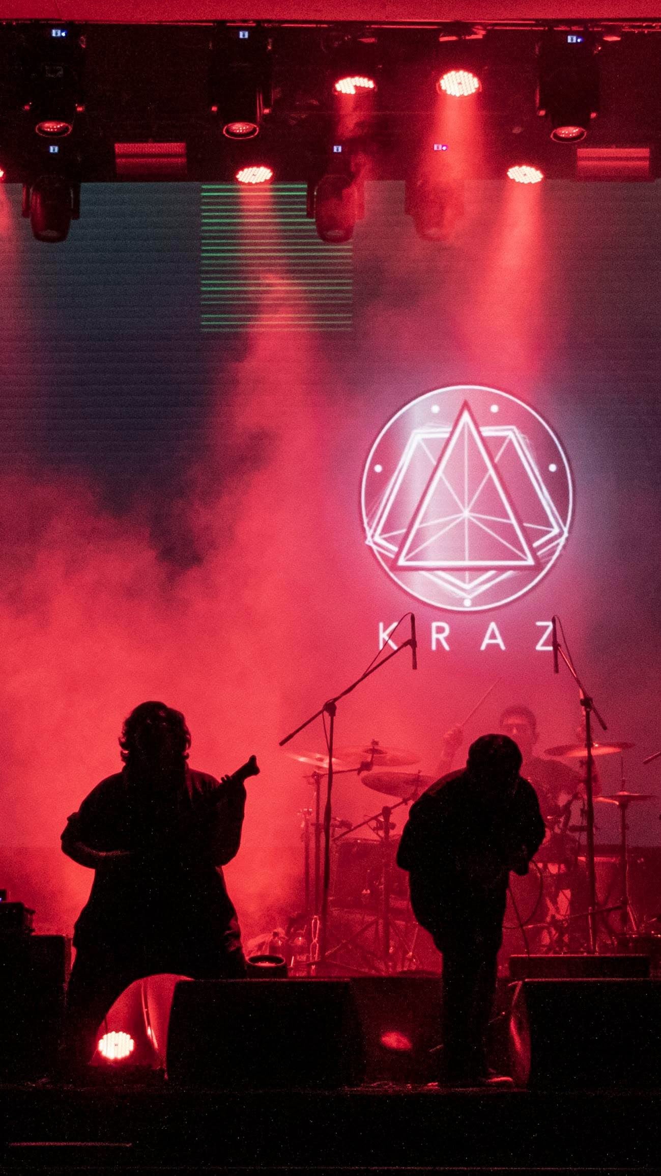 KRAZ performing under red stage lighting