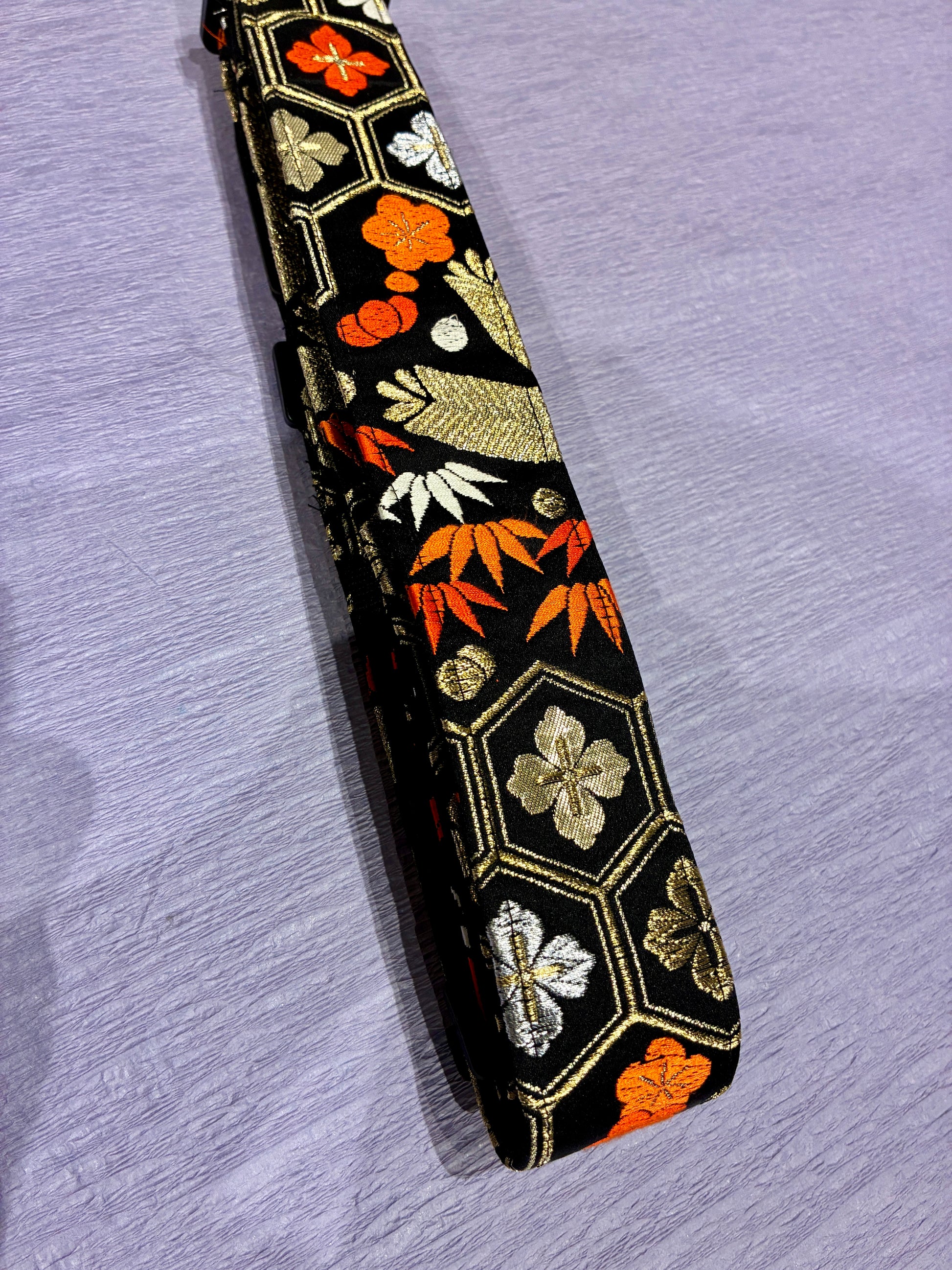 Hanakikko No.01A — Kimono Obi Guitar Strap, full view of the strap showing the flower and geometric weave.