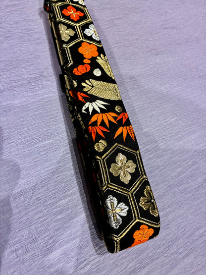 Hanakikko No.01A — Kimono Obi Guitar Strap, full view of the strap showing the flower and geometric weave.