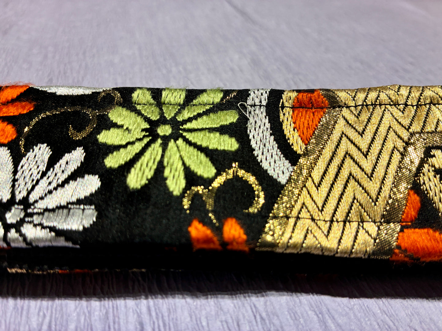 Kiku No.01A — Kimono Obi Guitar Strap, full view of the strap showing the chrysanthemum motif.