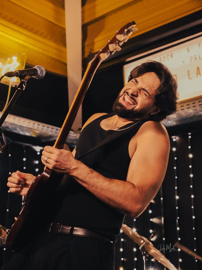 D. LATORRE performing live with a Gibson SG